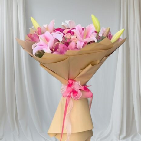 pink lilies and pergola roses